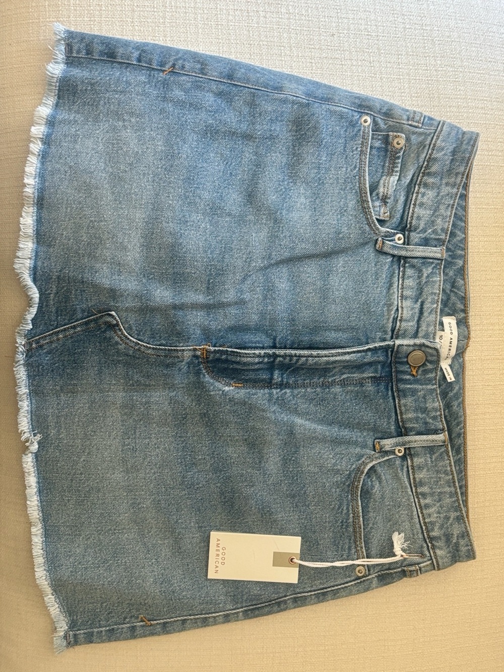 Good American Light Blue Denim Mini Skirt with Frayed Hem